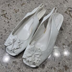 Chic White Slingback Heels with Floral Accent‎